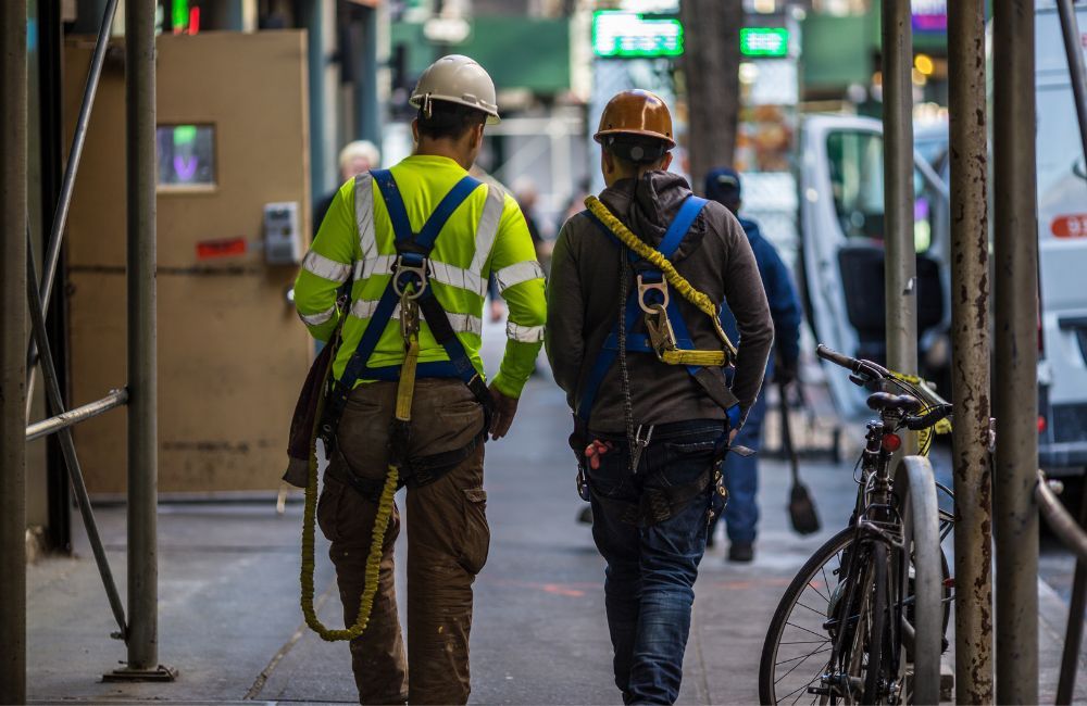 Construction workers walking through a construction site